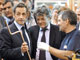  French President Nicolas Sarkozy (2ndR) and Ecology, Energy and Sustainable Development and Climate Negotiations State minister Jean-Louis Borloo (C) visit a factory of the Ciat group, working on heat exchange(Photo:  AFP) 