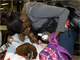 Canadian evacuees from Haiti hug as they arrive in Montreal(Photo: Reuters)