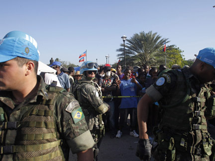 United Nations soldiers from Brazil distribute water in Port-au-Prince.Photo: Reuters/Eliana Aponte