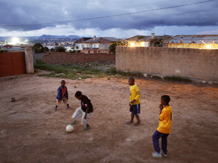 Boys play football in the streets of Lubango.Photo: Reuters