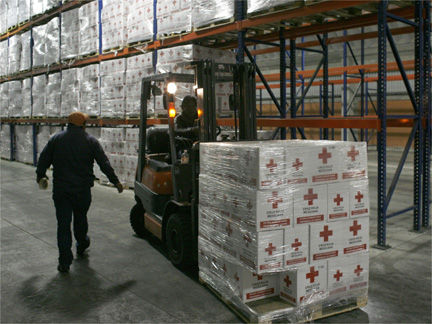 A Red Cross worker loads humanitarian aid boxes to be sent to Haiti at the Red Cross Center in Toluca, Mexico(Photo: Reuters)