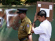 A police officer escorts a man carrying a ballot box to a polling station in Colombo.Photo: Reuters