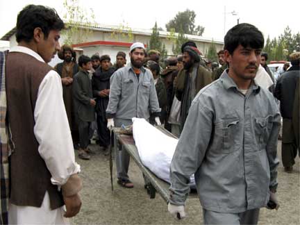 Hospital workers carry the body of a man killed in the Lashkar Gah blast(Photo: Reuters)