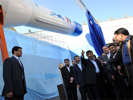 Iranian President Mahmoud Ahmadinejad looks at the rocket during a ceremony in Tehran on 3 February(Photo: Reuters)