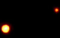 Plutón y su luna Caronte.© NASA