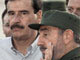 Le président mexicain Vincent Fox (G) et son homologue cubain Fidel Castro 

		(Photo : AFP)