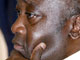 A la sortie de l'office religieux Laurent Gbagbo déclare : «Soyons et forts et courageux». 

		(Photo : AFP)