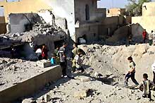 A Falloujah, maison détruite par un raid aérien américain le 30 septembre 2004. 

		(Photo: AFP)