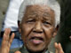 Nelson Mandela lors de l'annonce du décès de son fils par le sida. 

		(Photo : AFP)