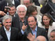 Lionel Jospin (fond, C), son épouse Sylviane Agacinski (fond, D) arrivent avec François Hollande (1er plan C), sa compagne Ségolène Royal (D) et le maire de La Rochelle Maxime Bonon (G) à l'espace Encan pour le repas de la deuxième journée de l'université d'été du PS, le 27 août 2005 à La Rochelle.(Photo: AFP)