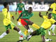 A l'image d'Achille Webo triomphant face à deux défenseurs togolais, les « lions indompables » ont littéralement dévoré les « éperviers ».(Photo : AFP)