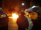 Un car de police brûle à Montfermeil. 

		(Photo : AFP)