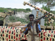 Milicien islamiste à Mogadiscio près d'un «&nbsp;technical&nbsp;» équipé d'une mitrailleuse lourde. 

		(Photo : AFP)