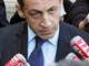 Nicolas Sarkozy à la sortie d'une réunion sur la sécurité et les transports publics à Matignon. 

		(Photo : AFP)
