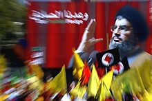 Manifestation de soutien au Hezbollah devant un portrait de son leader Hassan Nasrallah, le 22 septembre 2006 à Beyrouth. 

		(Photo: AFP)