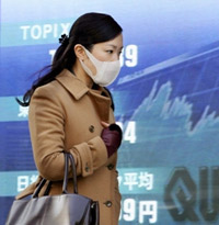 Une japonaise, à Tokyo, portant un masque pour se protéger de la pollution.(Photo : AFP)