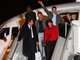 Nicolas Sarkozy et Rama Yade (g) en compagnie des 3 journalistes français lors de leur arrivée à l'aéroport de Villacoublay. 

		(Photo : AFP)