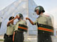 A Pékin, la sécurité est renforcée autour des installations sportives où des policiers paramilitaires sont postés.(Photo : Reuters) 