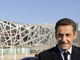 Le président français Nicolas Sarkozy, devant le stade olympique de Pékin, le 27 novembre 2007 au dernier jour de sa visite en Chine.(Photo : AFP)