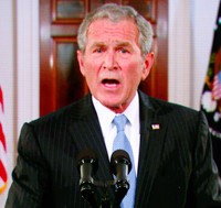 Le président américain George Bush s'est également exprimé via une liaison satellite de la Maison Blanche.(Photo : Reuters)