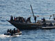 Des commandos de la marine indienne arraisonnent un bateau de pirates dans le Golfe d'Aden le 13 décembre 2008.(Photo : AFP)