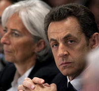 Le président français, Nicolas Sarkozy (d) et la ministre de l'Economie, Christine Lagarde, deux jours avant la grève nationale du 29 janvier.(Photo : Philippe Wojazer/Reuters)