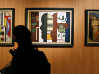 « La Composition dans l'usine » , le « profil noir » de Fernand Léger et « Il Ritornante »  de Giorgio de Chirico, à la présentation de la collection de Yves Laurent Saint Laurent et Pierre Bergé au Grand Palais à Paris, le 21 février 2009.( Photo : Regis Duvignau /REUTERS)