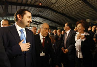 Saad Hariri (g), chef de file de la coalition majoritaire du «14 mars», lors du lancement de la campagne électorale pour les législatives à Beyrouth, le 14 mars 2009. (Photo : AFP)