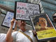 Des militants d'Amnesty international manifestent contre la détention d'Aung San Suu Kyi devant le ministère chinois des Affaires étrangères à Hong Kong, le 21 mai 2009.(photo : AFP)
