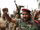 Le général tchadien Hassane al-Djinedi (c) et ses soldats crient victoire à Am-Dam, le 8 mai 2009.(Photo : AFP)