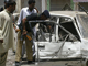 La police pakistanaise sur les lieux de l'attentat, au nord-ouest de Dera Ismail Khan, le 14 juin 2009.(Photo : Reuters)