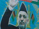 Des Afghanes attendent le bus sous un poster géant du candidat Hamid Karzaï, candidat à sa propre réélection à la présidence de l'Afghanistan, le 25 juin 2009.(Photo : Reuters)