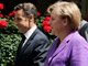 Le président français, Nicolas Sarkozy (g) et la chancelière allemande, Angela Merkel (d) marchant dans les rues de Paris après le sommet bilatéral à l'Elysée, le 11 juin 2009.(Photo : Reuters)