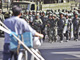 Les forces de sécurité chinoises patrouillent dans les rues d'Urumqi, le 11 juillet 2009. (Photo : Reuters)