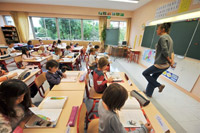 Класс начальной школы во французском городе Кан 2 сентярбя 2009 г., в первый день учебного года
(Photo : AFP)