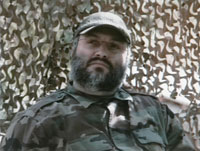 Un portrait d'Imad Moughnieh (non daté) sur les écrans de la chaîne de télévision Al-Manar du Hezbollah.(Photo : Reuters)